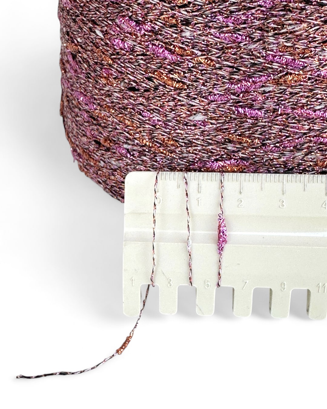 “Sunset Twist” — bold knot yarn with pink and copper sparkle