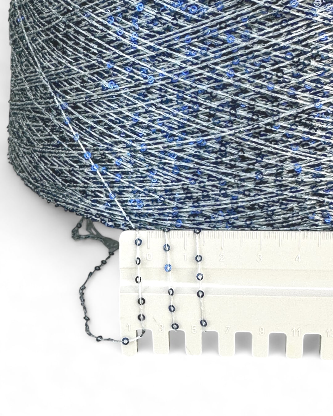 Close-up of “Blue Frost” with ruler — thin thread and blue sequins