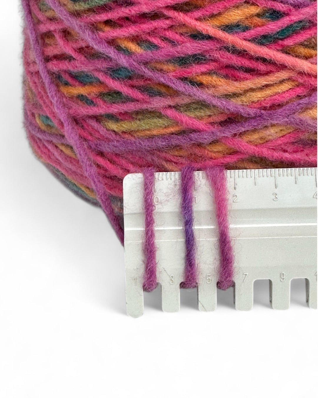 Bright yarn cone in fuchsia and rainbow mix — VEYARN