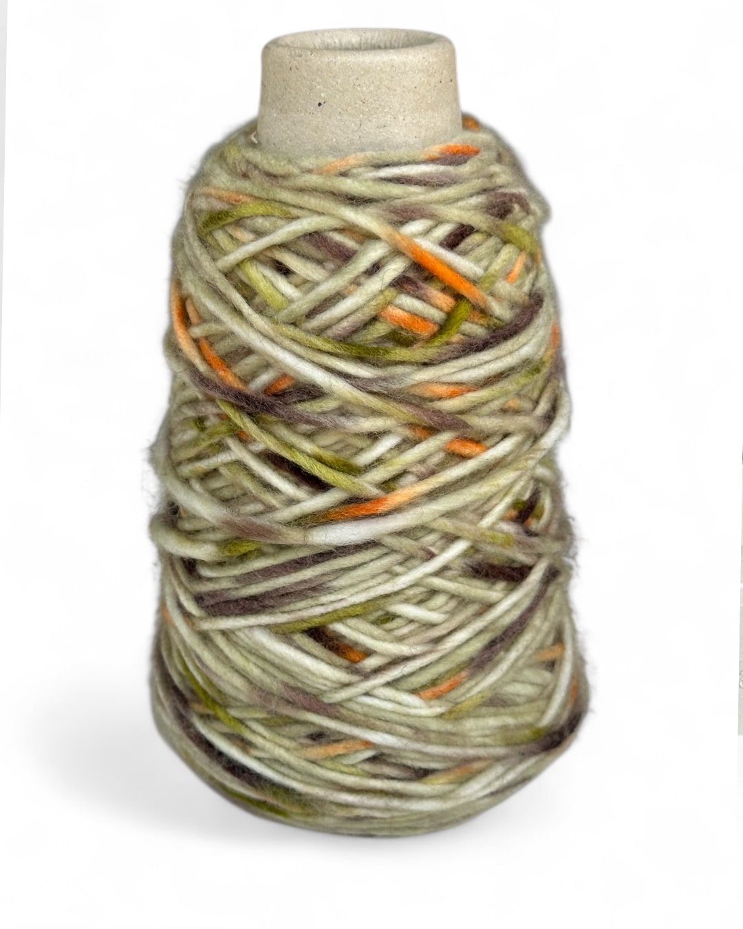 Cone yarn in earthy olive and orange tones — VEYARN