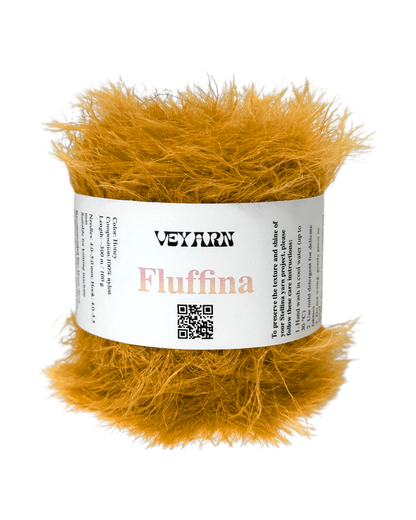 Ball of yellow yarn with 'Veyarn Fluffina' label on a white background