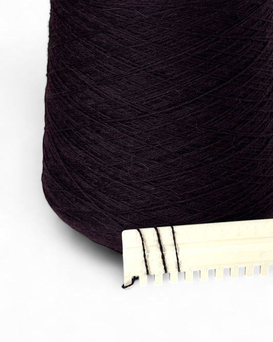 Close-up of fine angora-wool yarn in deep eggplant shade