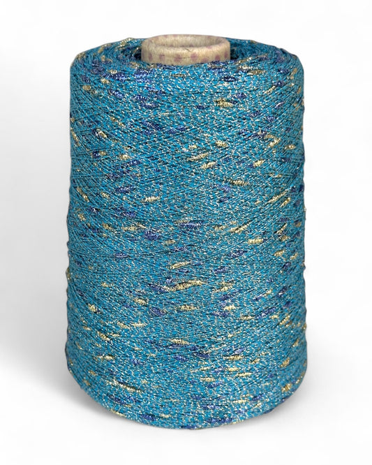 Stellina yarn in Treasure Bay — turquoise yarn with gold and cornflower blue knots, cone and close-up with ruler