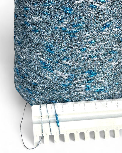 Close-up of Stellina Ice Flash yarn and ruler showing knot texture