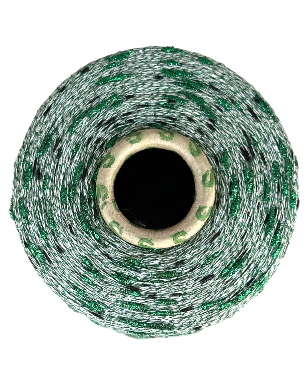 Roll of green and white string on a white background