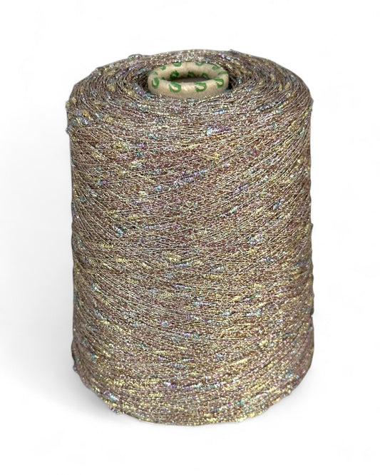 Stellina “Gilded Mist” knot yarn with gold base and colorful sparkle, on cone