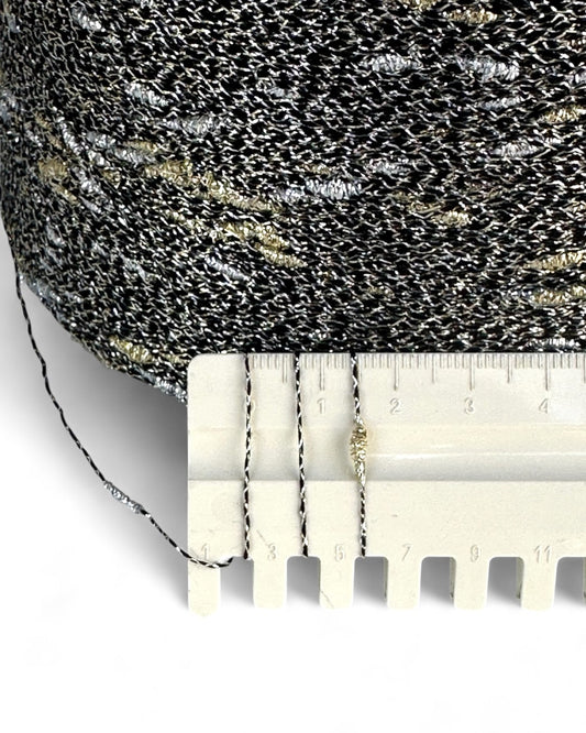 Textured fabric with a ruler for scale on a white background