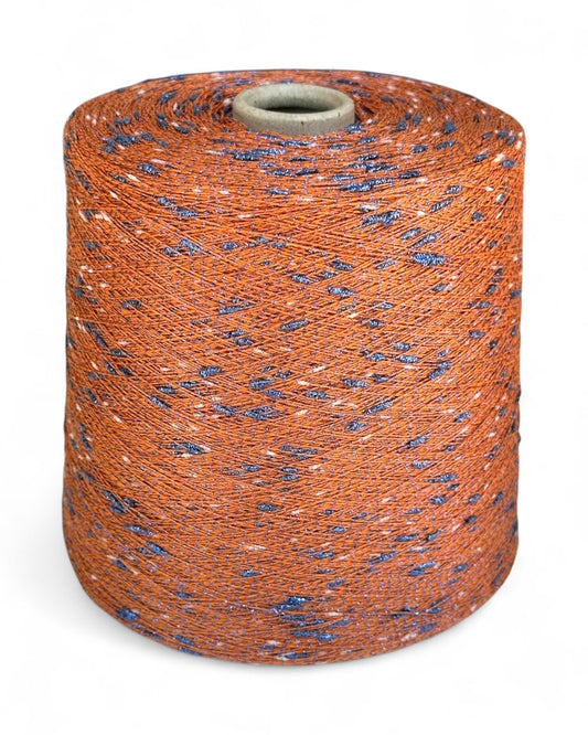 Ember Sky knot yarn with burnt orange base and blue sparkle accents