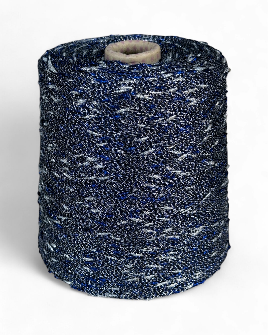 Stellina yarn in Midnight Spark — navy yarn with silver and blue sparkle, cone view, top view, close-up with ruler