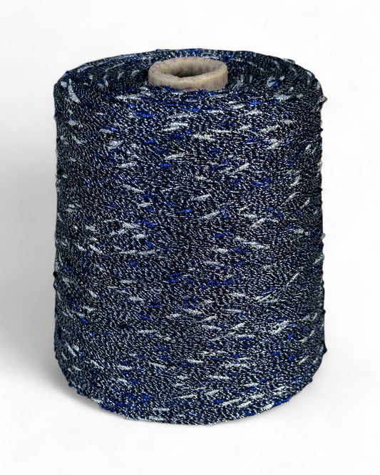 Stellina yarn in Midnight Spark — navy yarn with silver and blue sparkle, cone view, top view, close-up with ruler