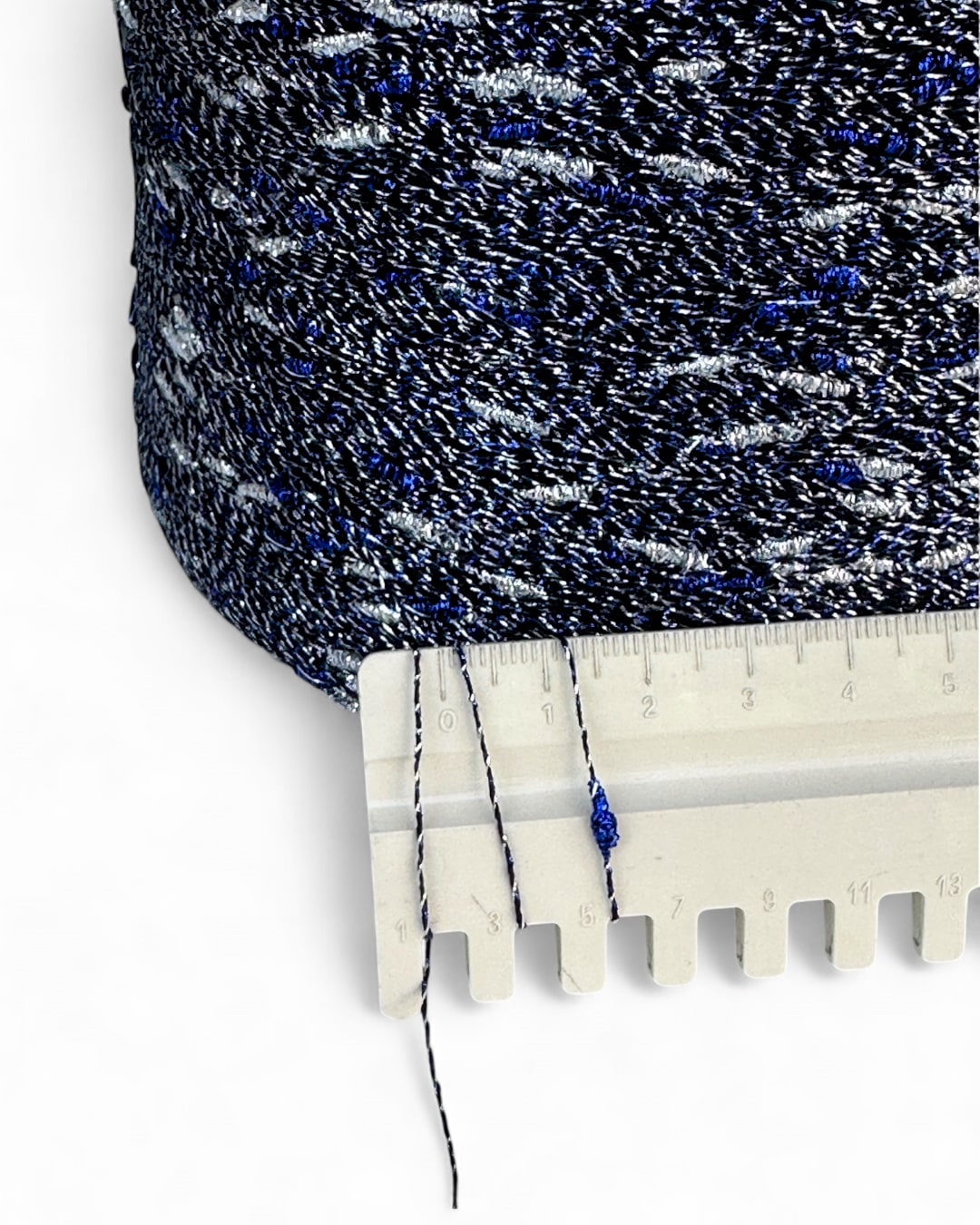 Textured fabric with a ruler showing measurement details