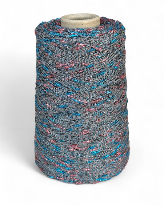 Stellina yarn in Electric Rose — sparkle yarn with pink and blue knots on silver base, cone and close-up with ruler