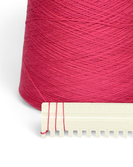 Pato — bright raspberry extrafine merino wool yarn on cone