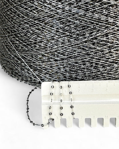 Close-up with ruler showing deep grey sequins