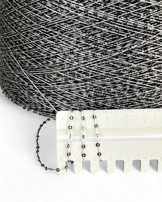 Close-up with ruler showing deep grey sequins