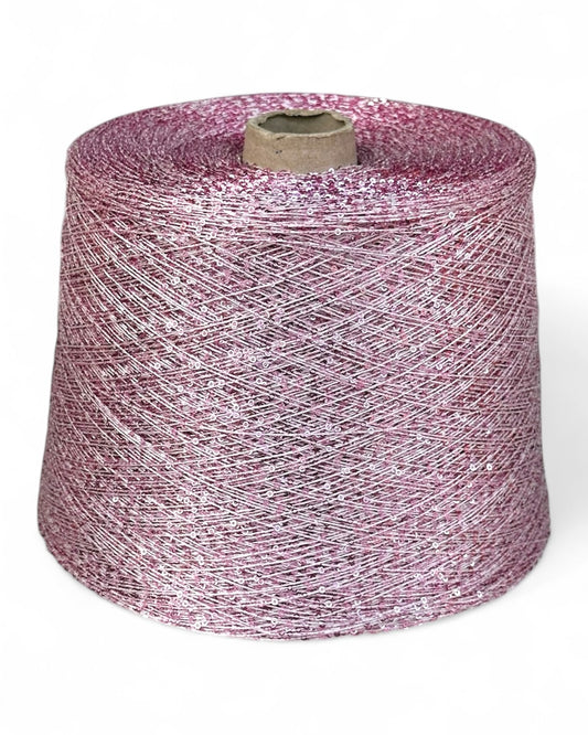 Blush pink sequin yarn “Blush Sparkle” on cone, front view