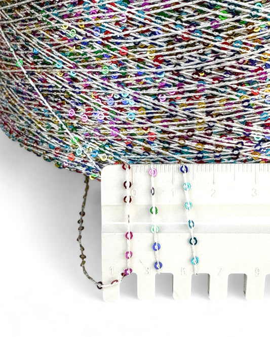 Close-up with ruler showing multicolor sequins
