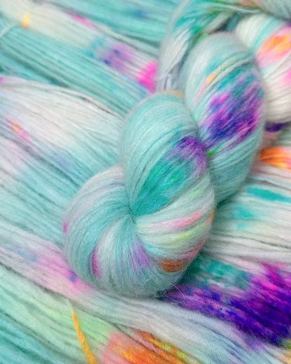 Hand-dyed artisanal knitting yarn with vibrant streaks of color on super baby alpaca base.Lightweight and durable nylon-infused alpaca-merino wool yarn in an array of pastel speckles.