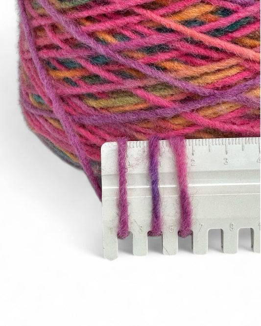 Bright yarn cone in fuchsia and rainbow mix — VEYARN