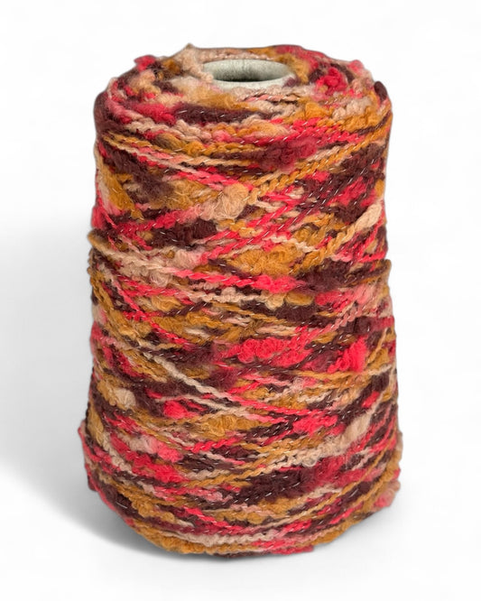 Cone of boucle yarn in cinnamon and fuchsia mix — VEYARN