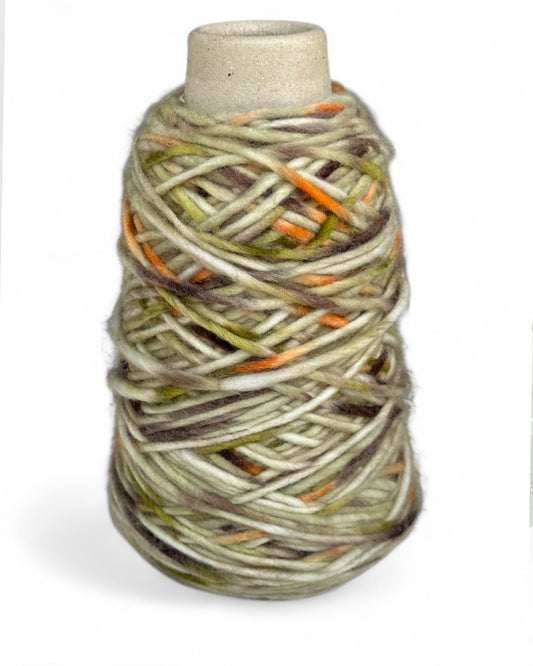 Cone yarn in earthy olive and orange tones — VEYARN